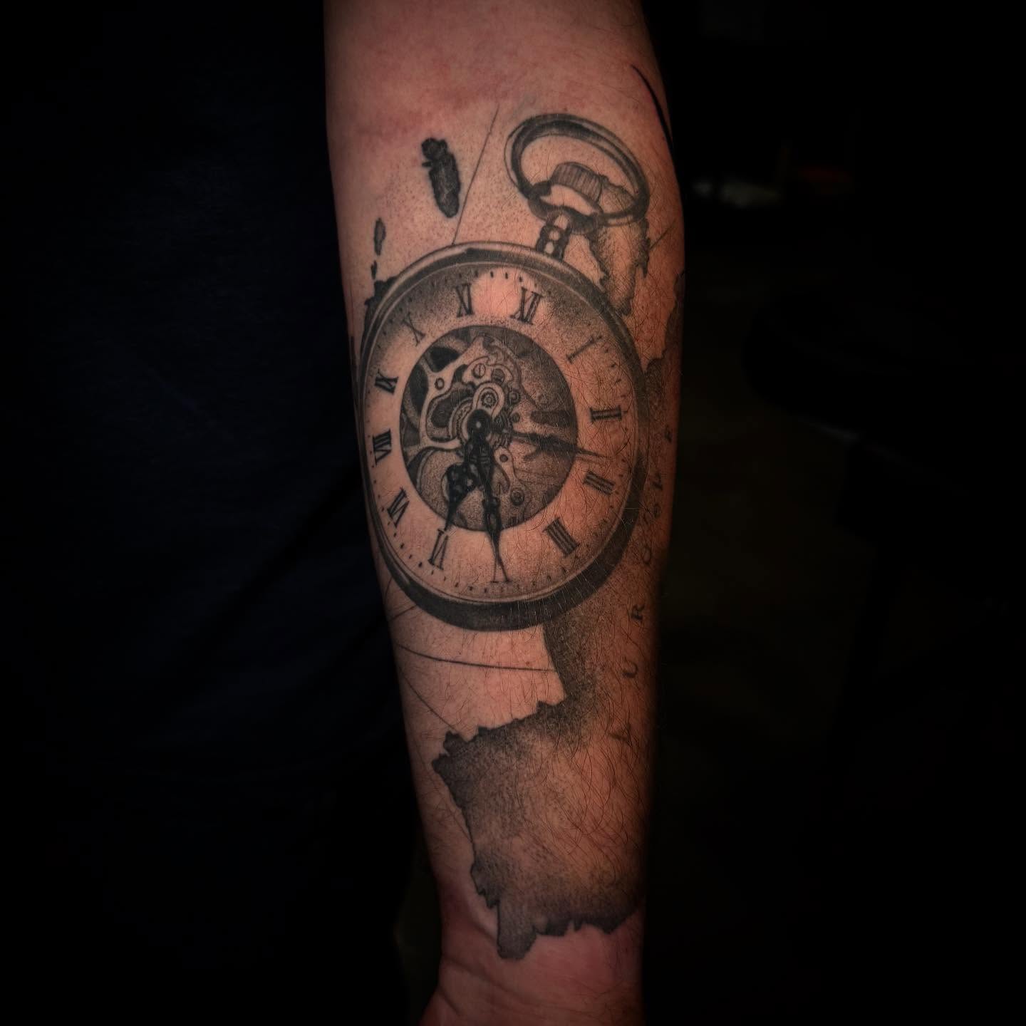 Pocket watch black and grey tattoo on the forearm by Carlos Lujan