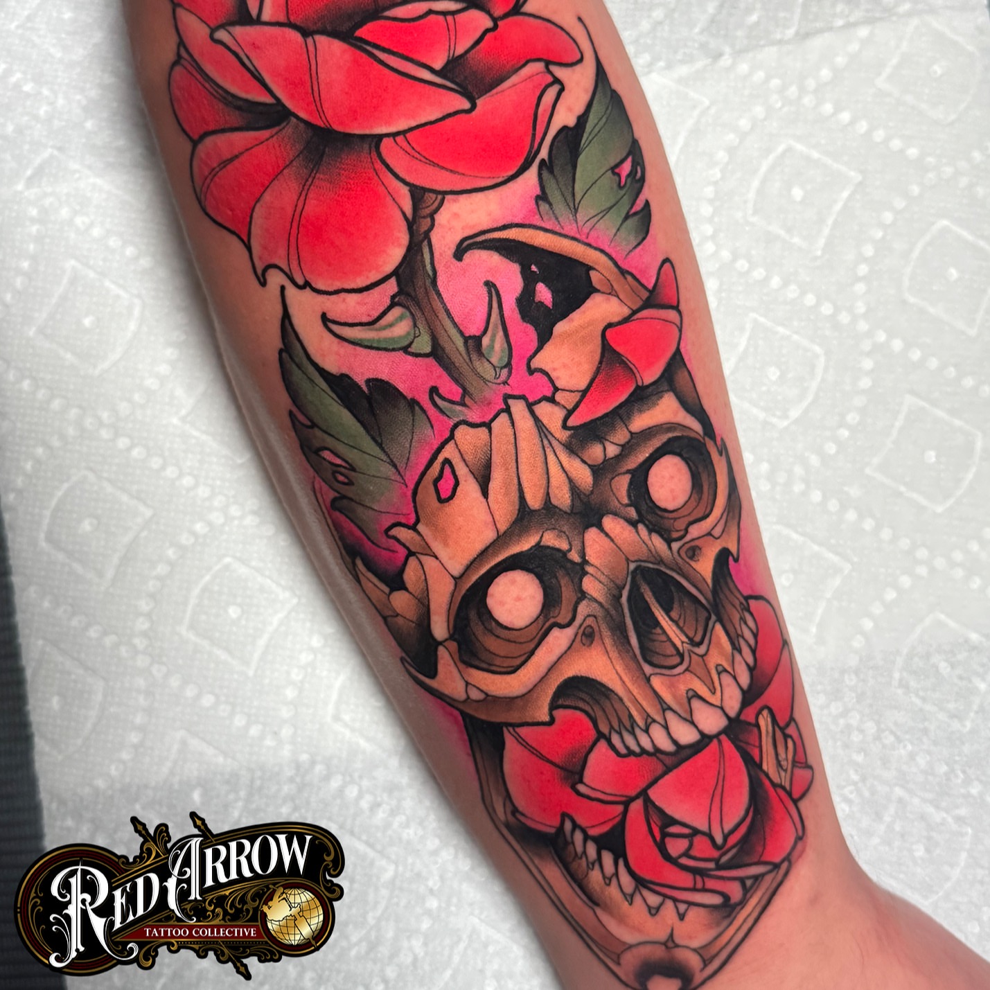 Skull and roses American traditional tattoo on the forearm by 𝕽𝖊𝖉 𝕬𝖗𝖗𝖔𝖜 𝕿𝖆𝖙𝖙𝖔𝖔 𝕮𝖔𝖑𝖑𝖊𝖈𝖙𝖎𝖛𝖊, Troy, Michigan