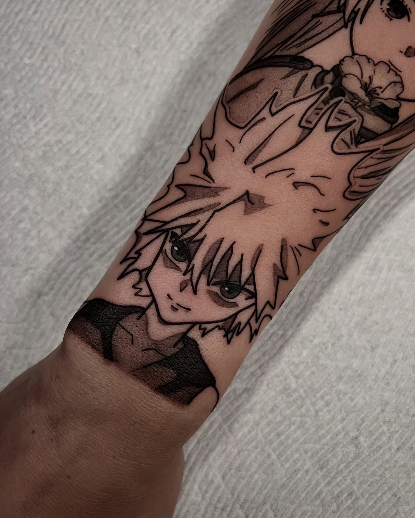 Anime character anime tattoo on the forearm by Chandler Roe