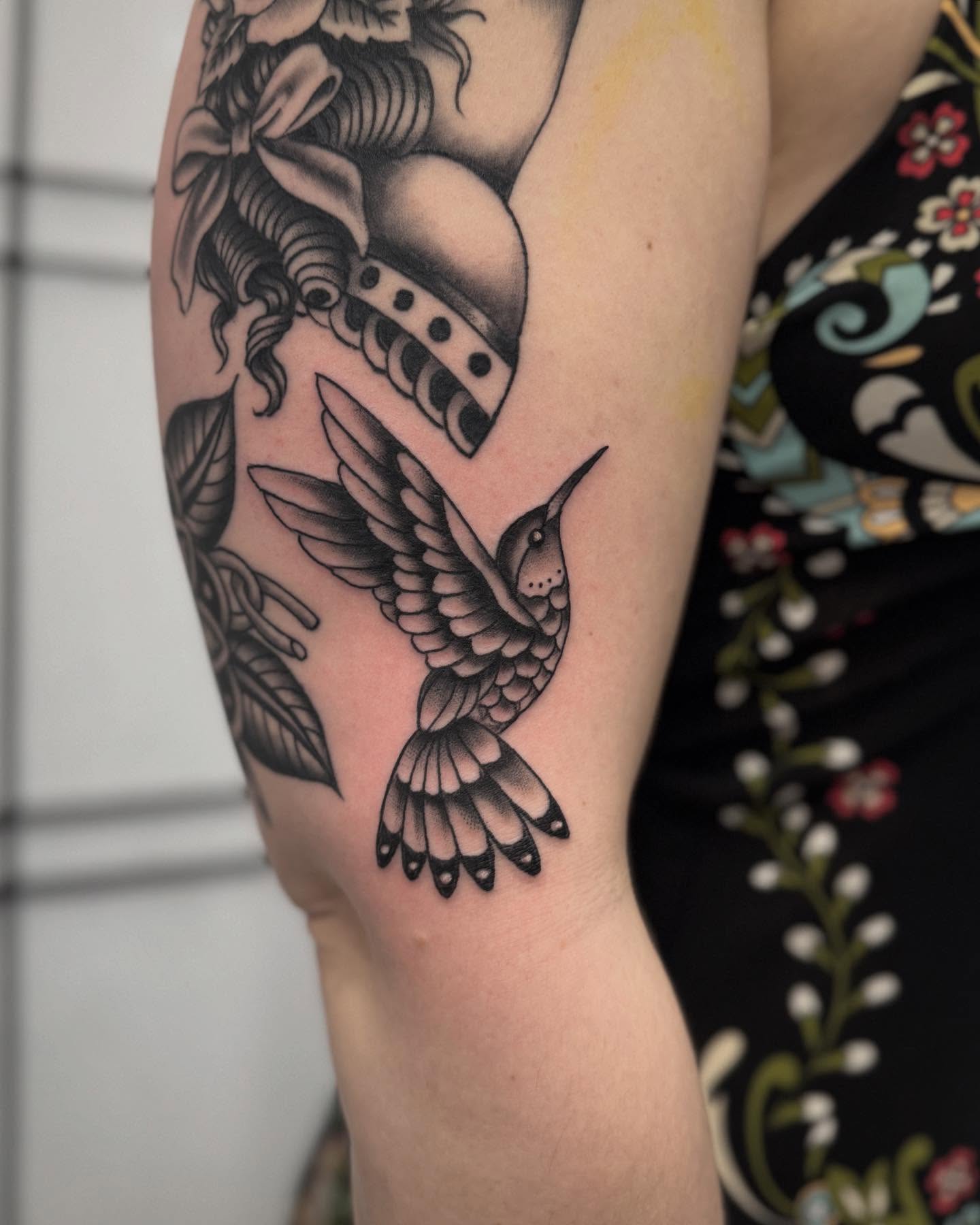 Hummingbird black and grey tattoo on the forearm by Micah Norman, San Francisco, California