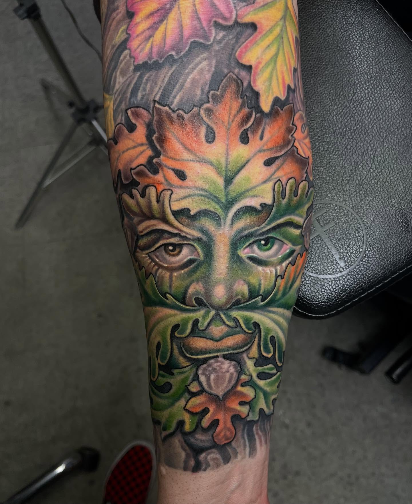 Green man realism tattoo on the forearm by scottyjstattoos