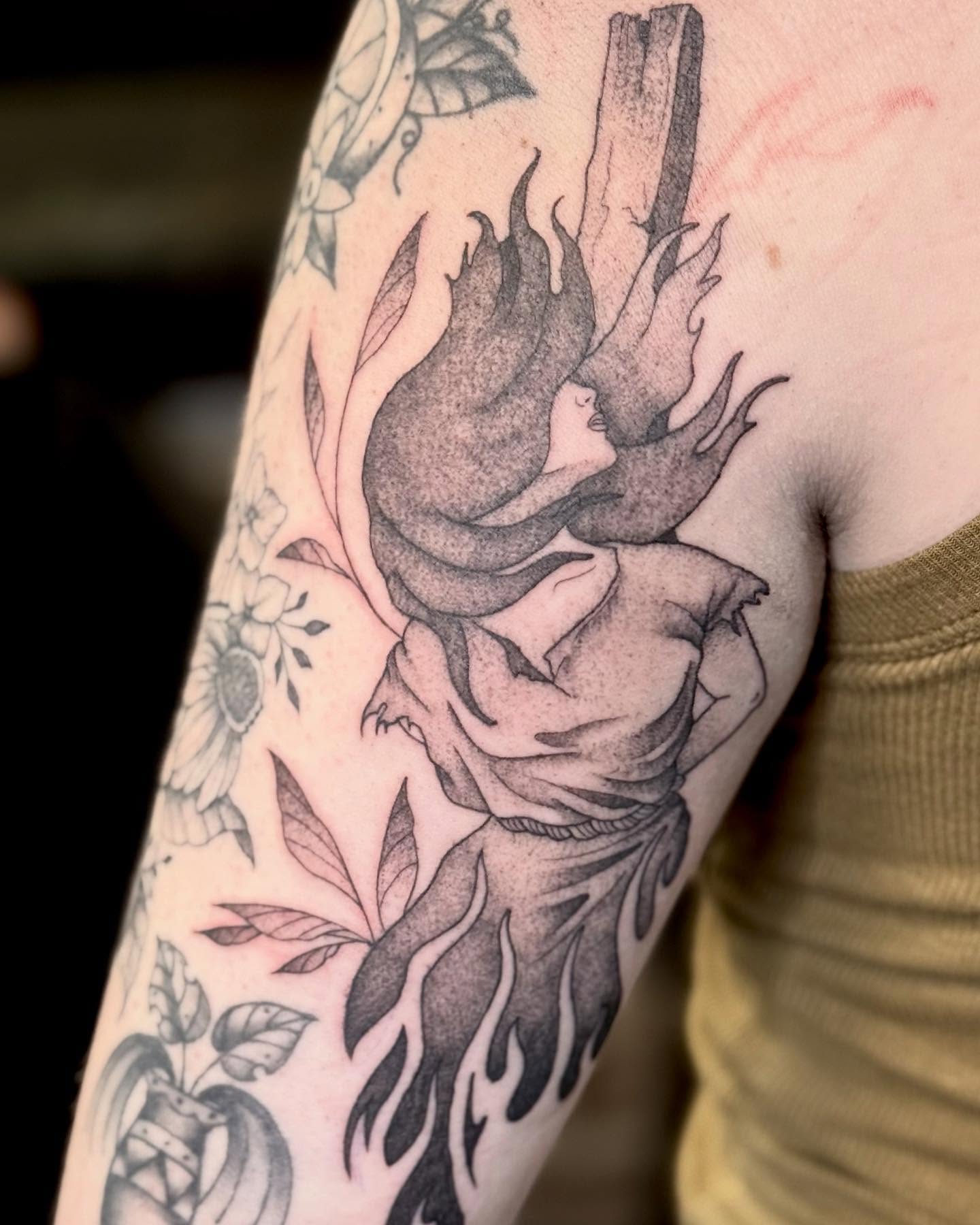 Flaming heart realism tattoo on the forearm by Katie Stacy