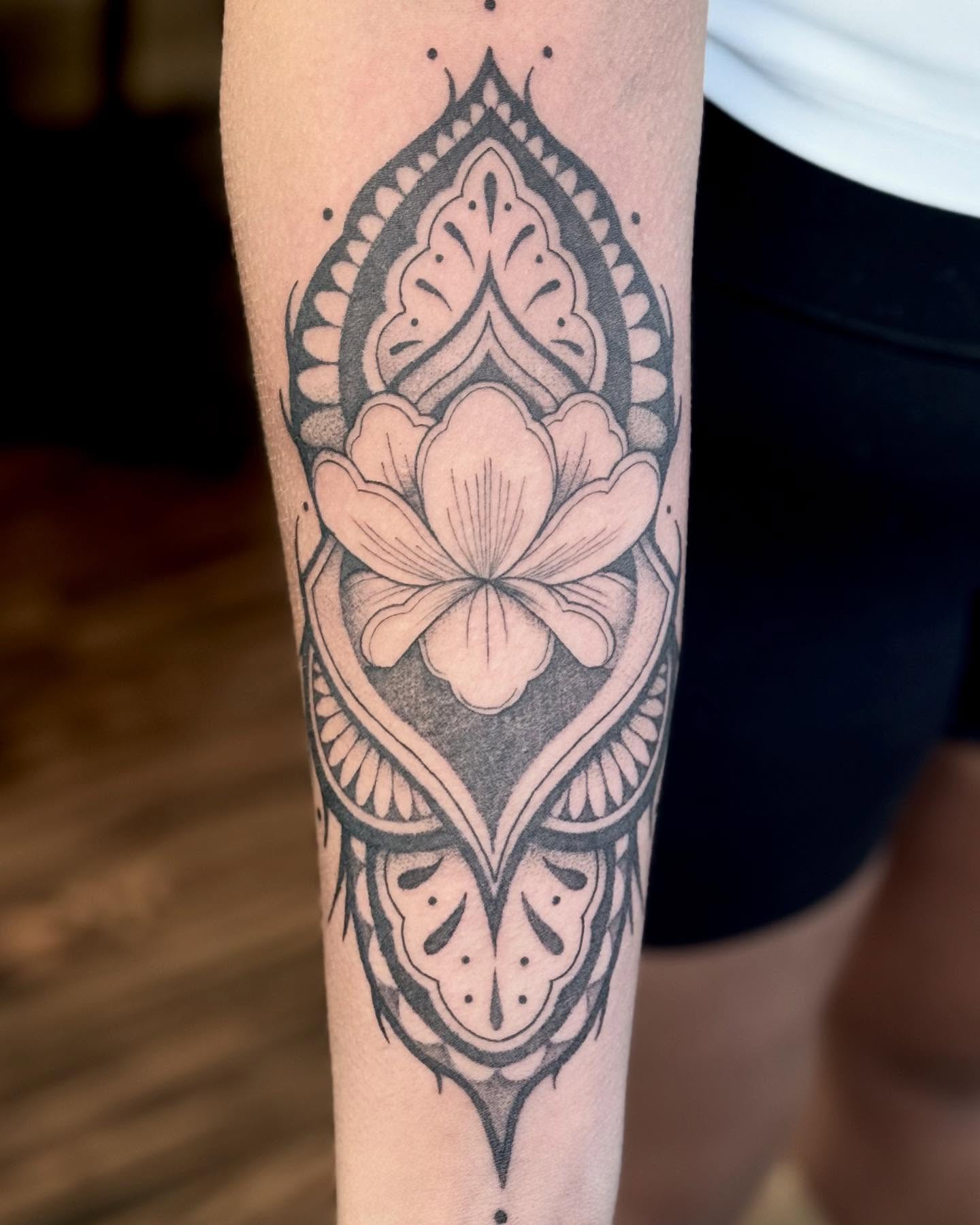 Lotus flower ornamental tattoo on the forearm by Katie Stacy