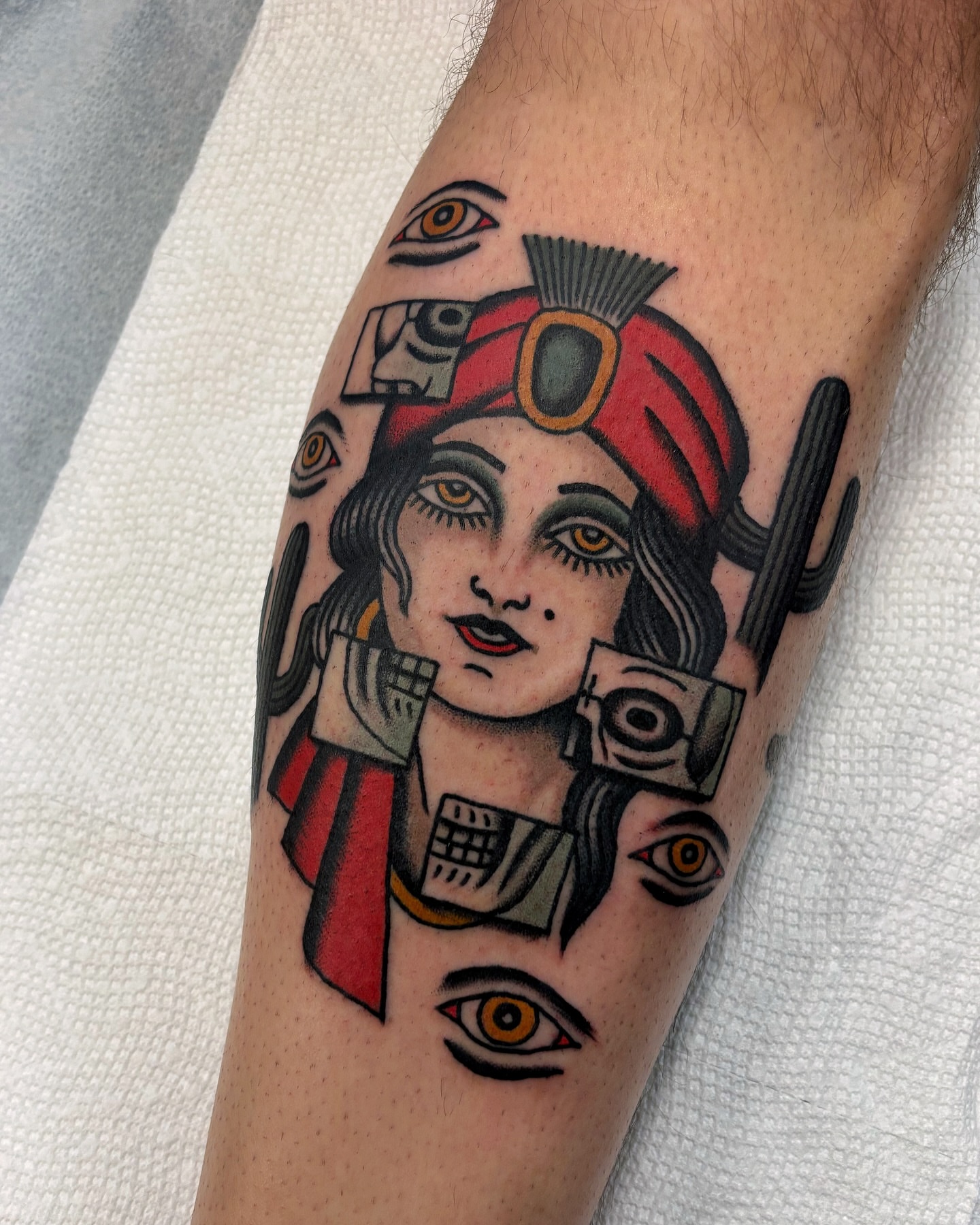 Woman with mechanical elements American traditional tattoo on the forearm by Ben Fiedler