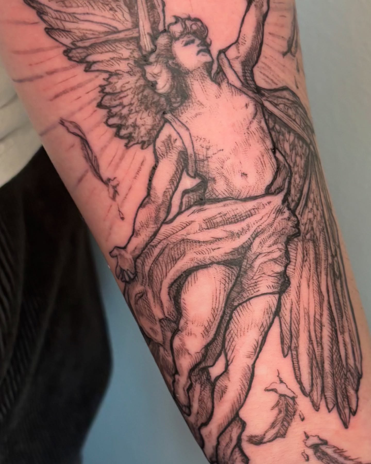 Angel black and grey tattoo on the forearm by Wren Cavanaugh Tattoos, Seattle, Washington