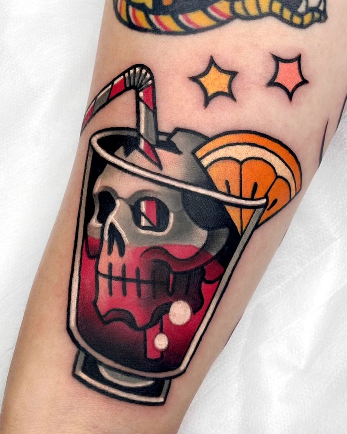 Skull in cocktail glass American traditional tattoo on the forearm by 부산타투
