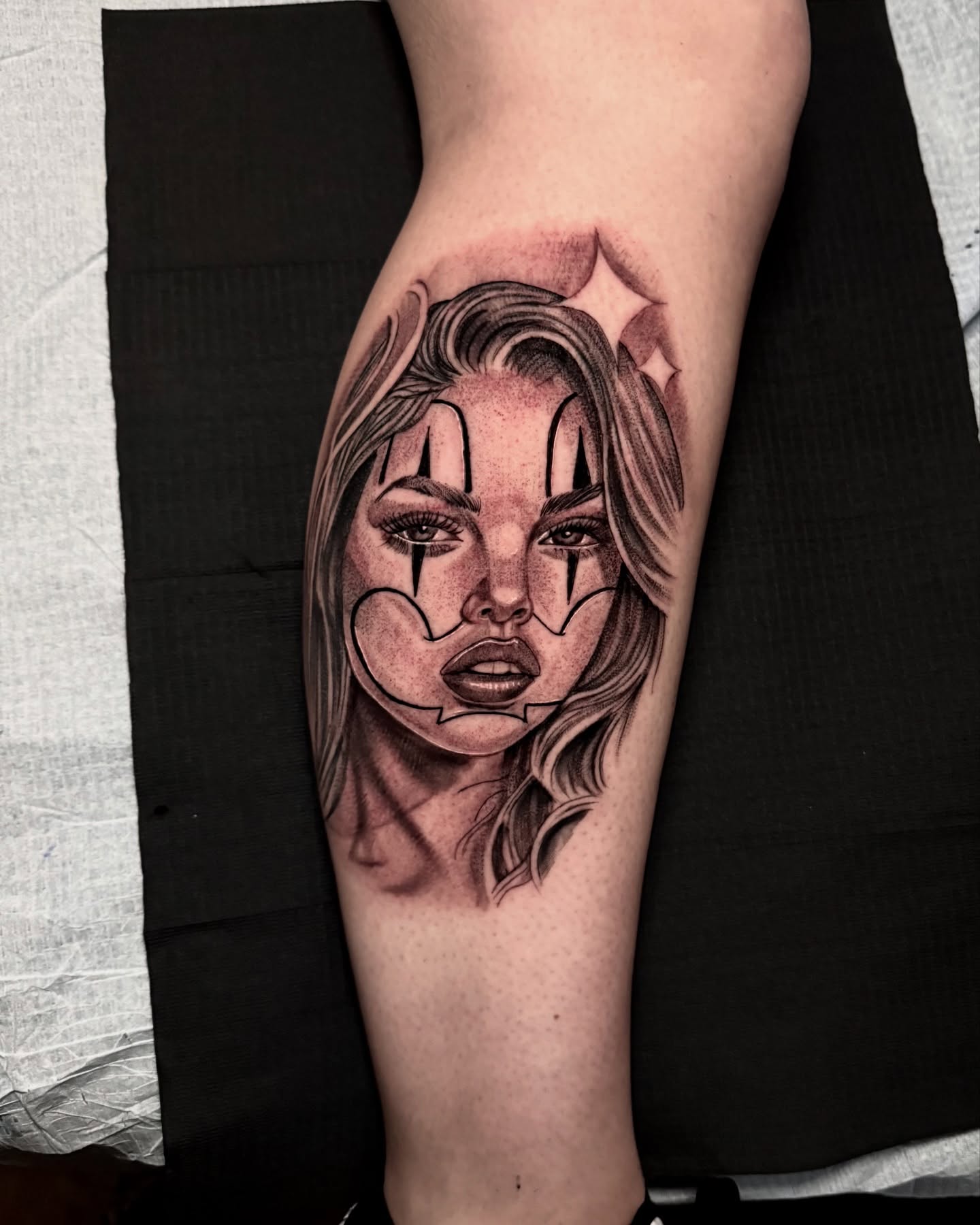 Woman's face realism tattoo on the forearm by Tattoo Artist