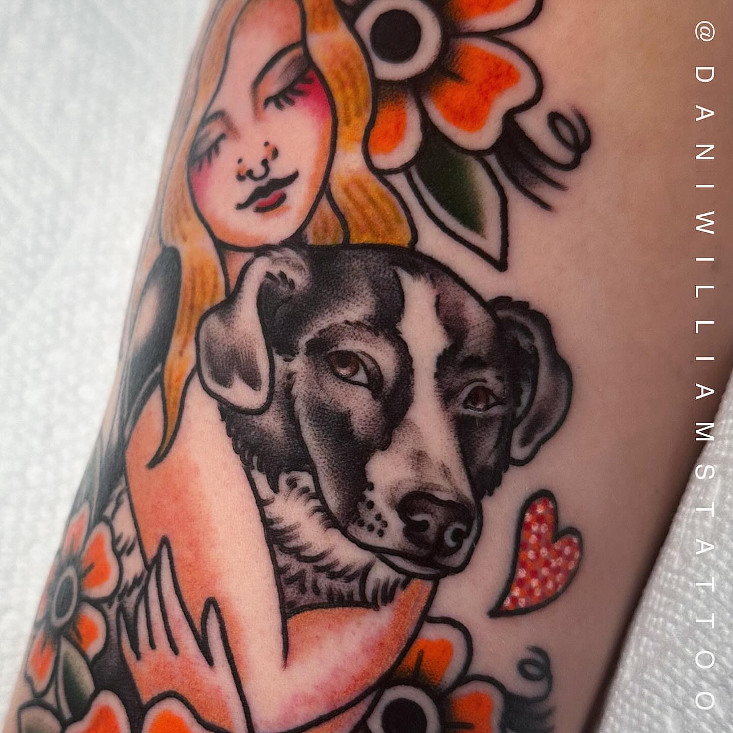 Woman and dog American traditional tattoo on the forearm by Dani Johnson