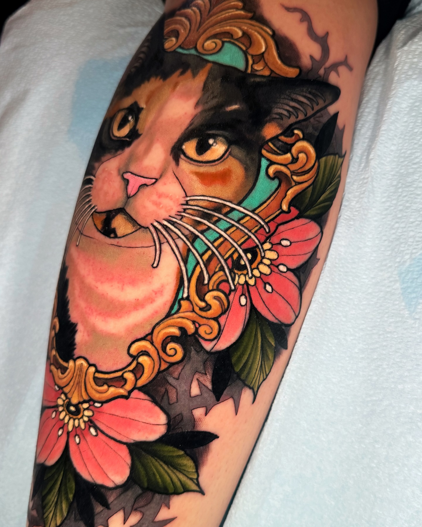 Cat with floral elements American traditional tattoo on the forearm by Austin Britt
