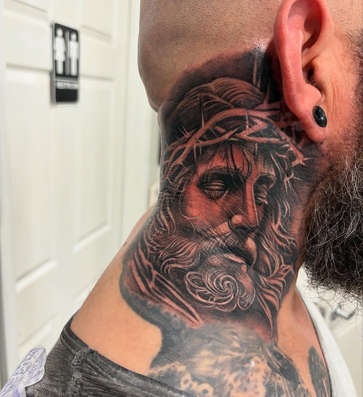 Religious figure realism tattoo on the neck by Juan Lira