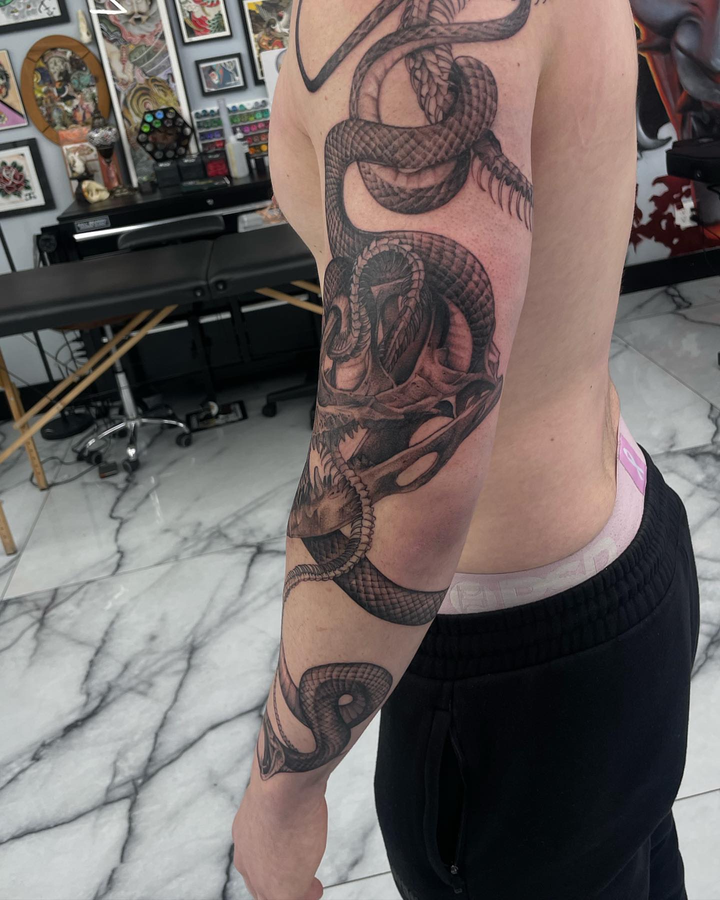 Snake black and grey tattoo on the forearm by Austin Jones