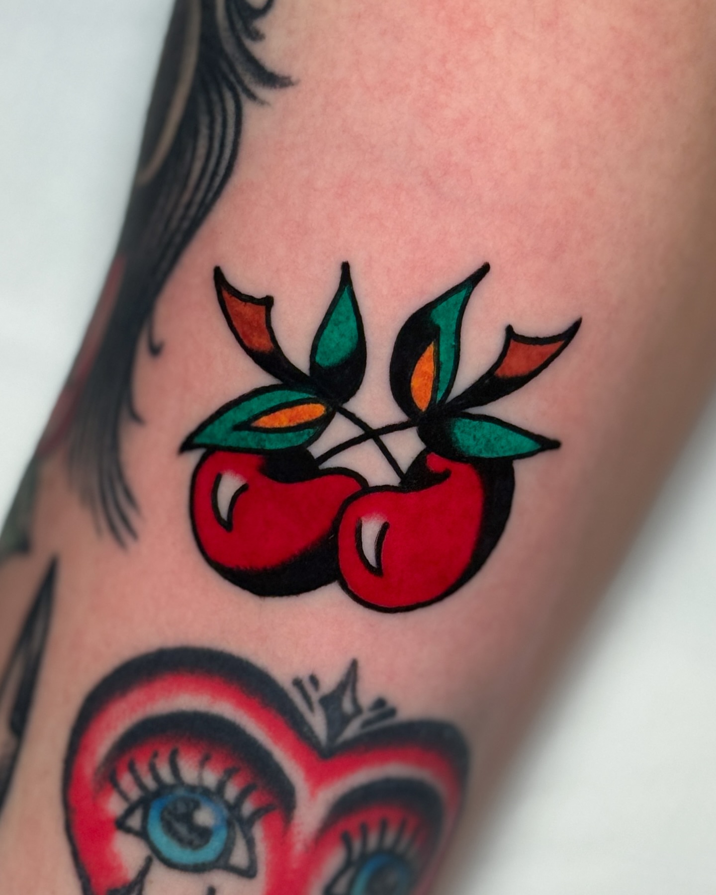 Cherries American traditional tattoo on the forearm by οΌππ¨ππ¨οΌ, New York, New York