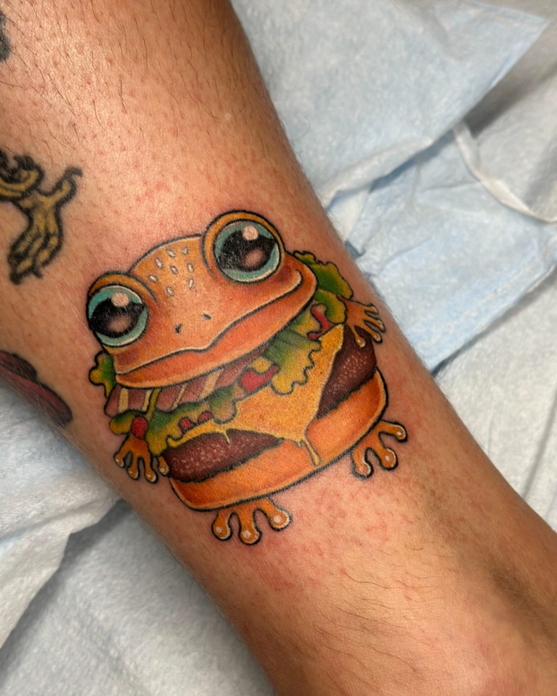 Frog realism tattoo on the forearm by Michele Estes