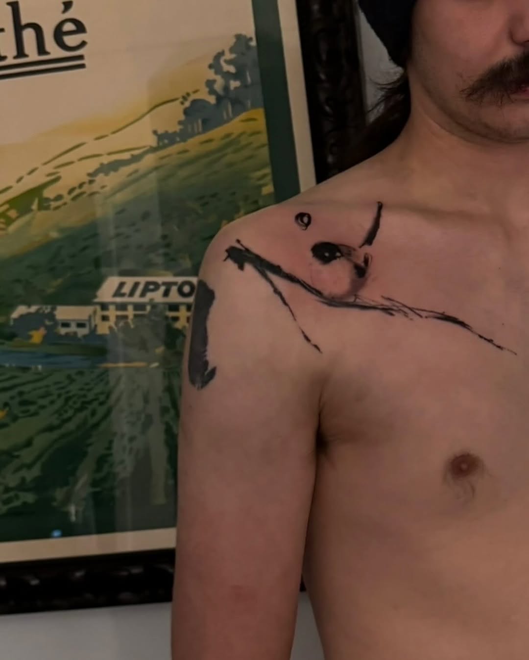 Bird on a branch minimalist tattoo on the shoulder by Blight