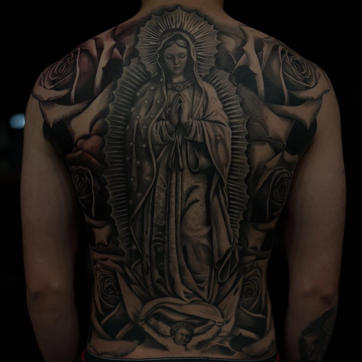 Our Lady of Guadalupe realism tattoo on the back by Lissy Red