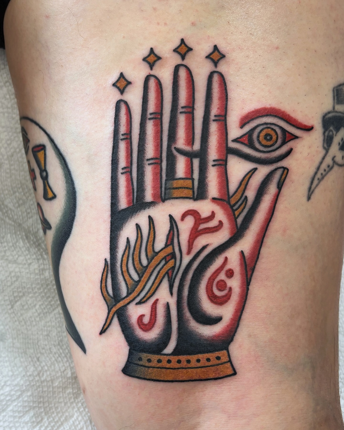 Hand with symbols American traditional tattoo on the forearm by Ben Fiedler