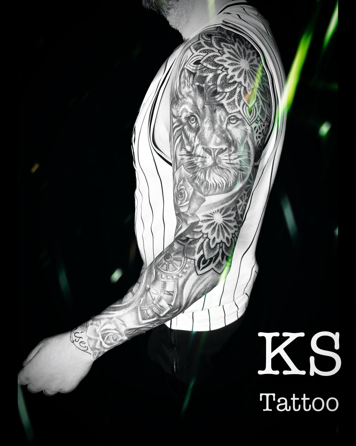Lion realism tattoo on the upper arm by Karen Smith