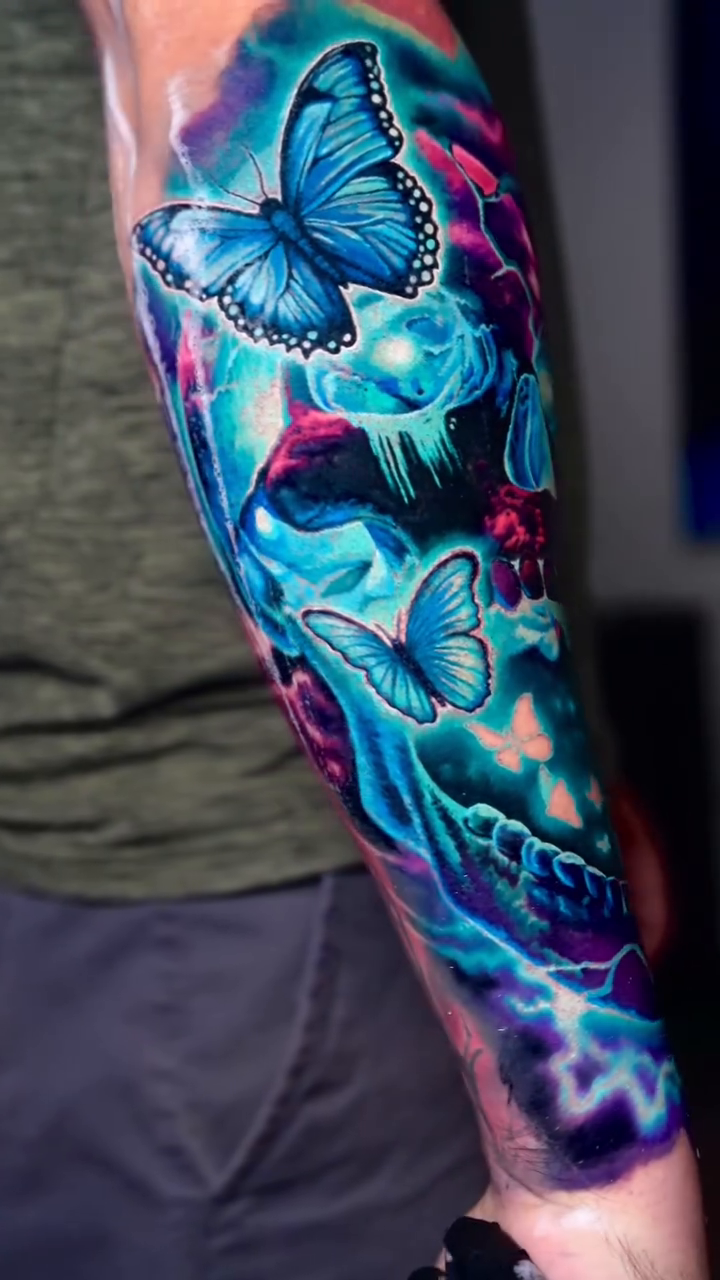 Skull with butterflies realism tattoo by Bobby Cupparo