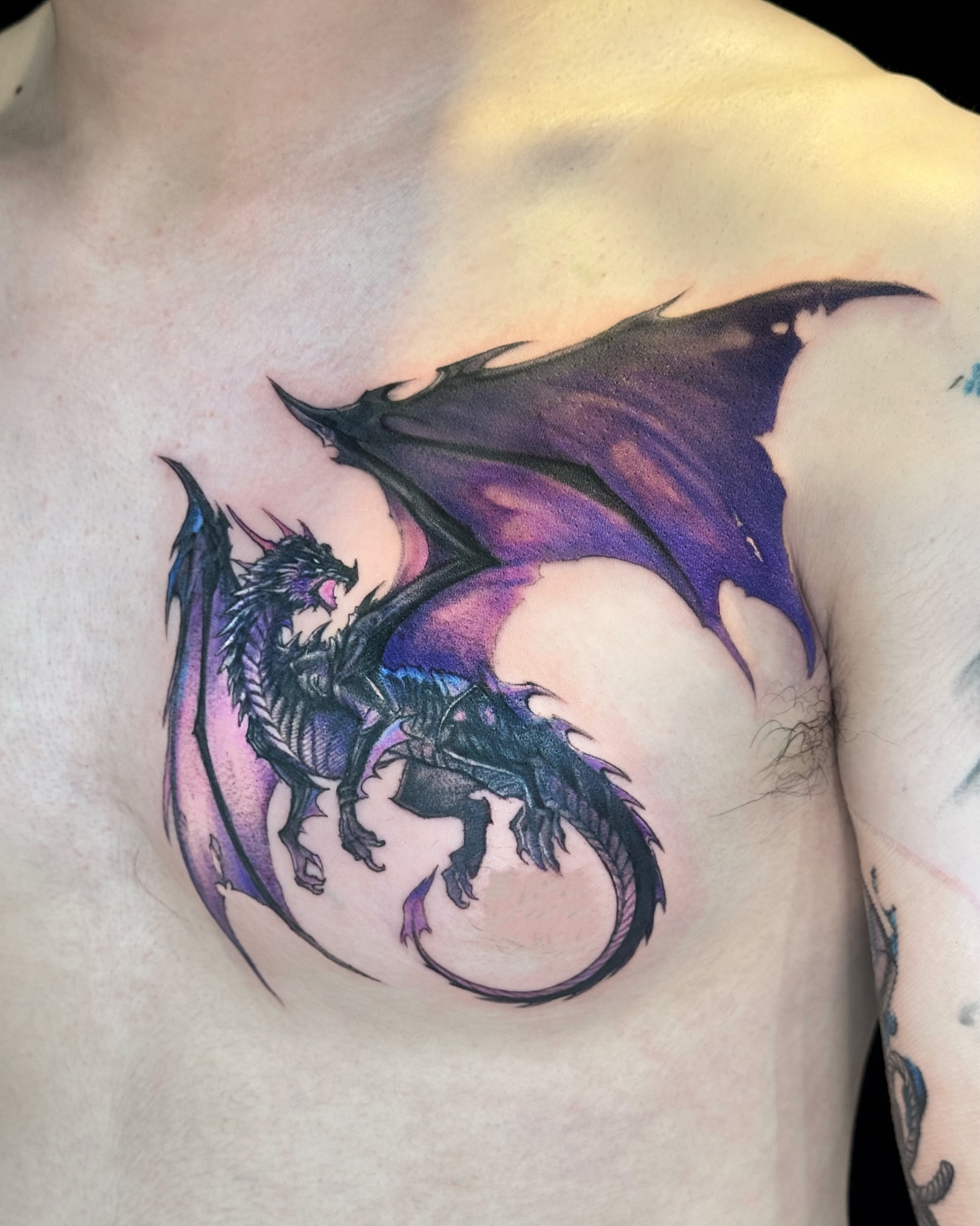 Dragon dark realism tattoo on the chest by Gen Li