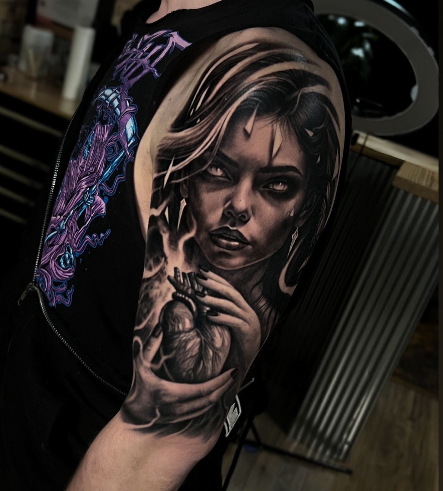 Woman holding heart realism tattoo on the forearm by Aaron, Milwaukee, Wisconsin