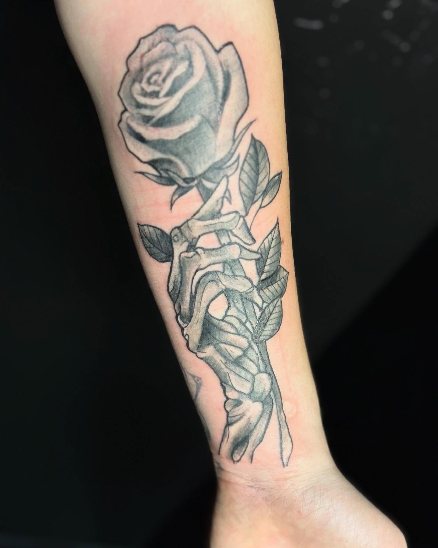 Rose and skeleton realism tattoo on the forearm by Christopher Allman, Cheviot, Ohio