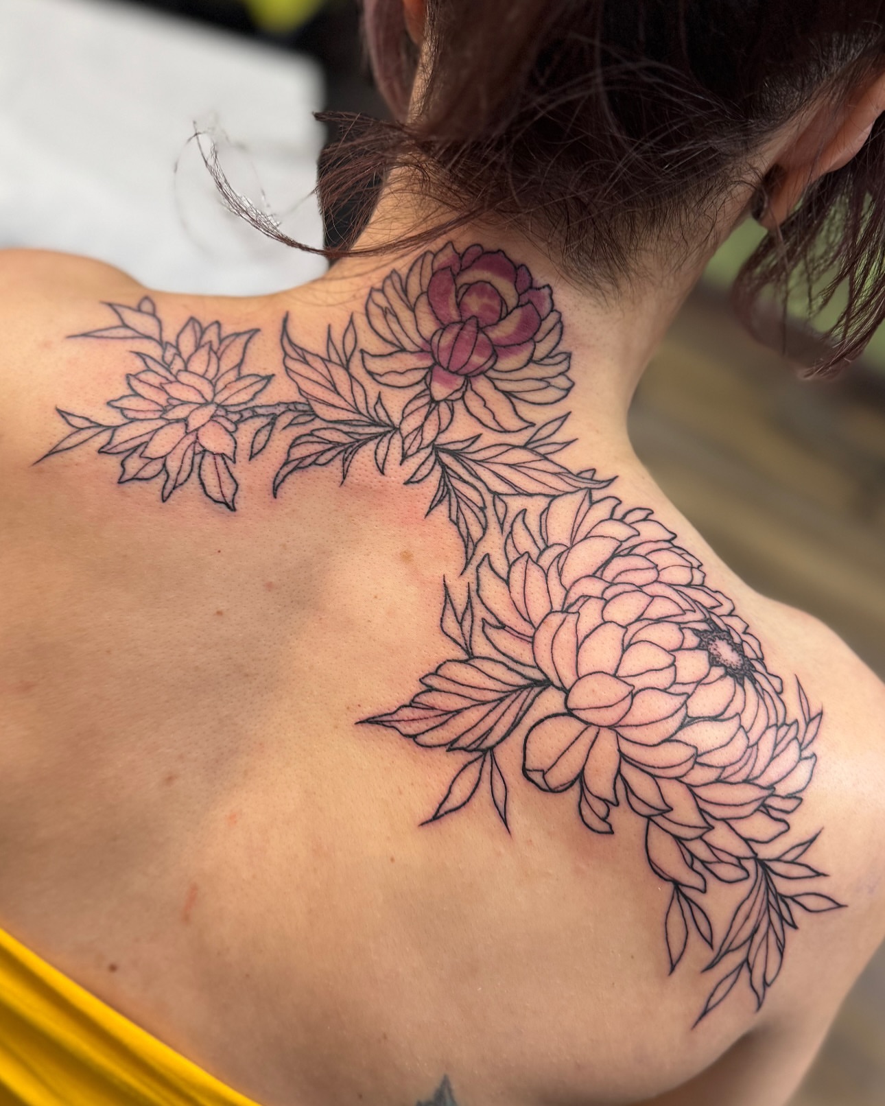 Floral arrangement black and grey tattoo on the back by Michael Langdale
