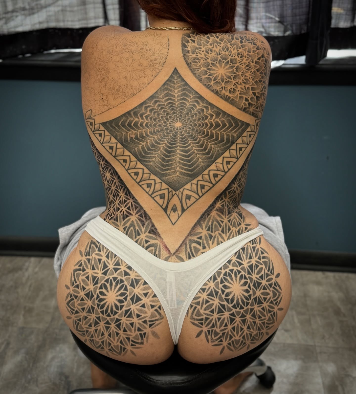 Geometric mandala geometric tattoo on the back by Paul Schnell