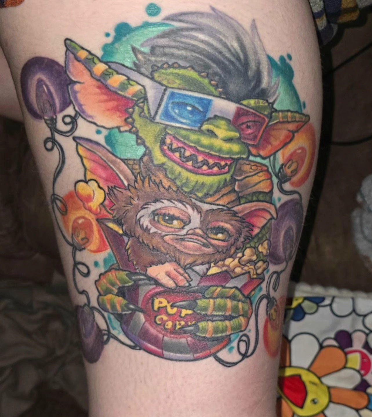 Gremlins new school tattoo on the thigh by Dawne Michele