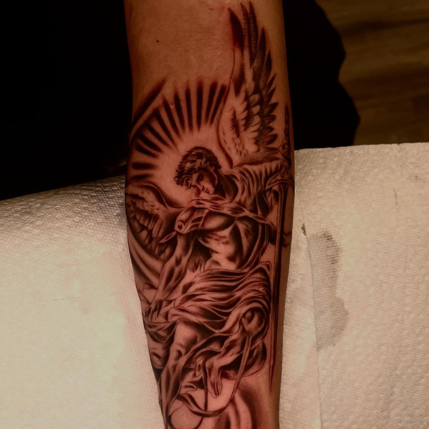 Angelic figure realism tattoo on the forearm by Kevyn Vidal