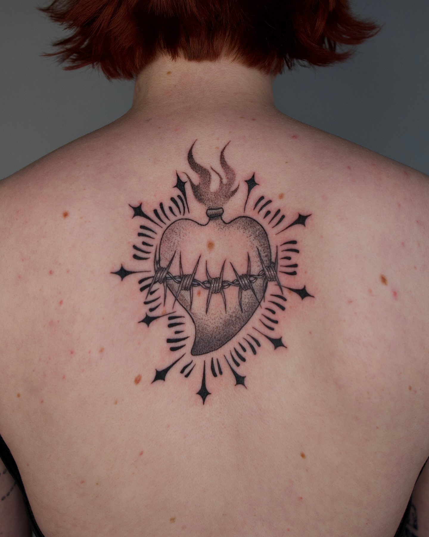Barbed heart black and grey tattoo on the back by šianca٠࣪ā