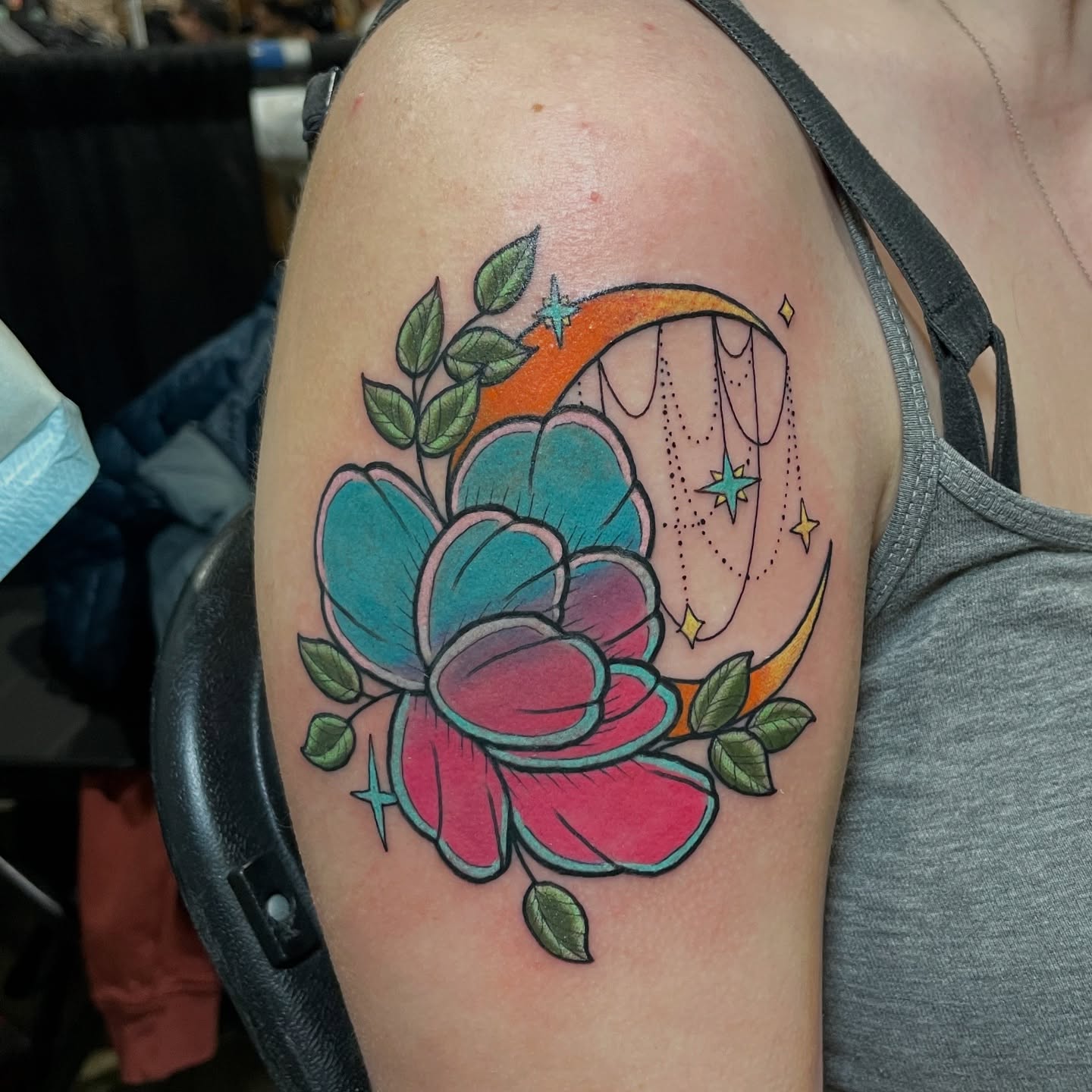 Flower and crescent moon American traditional tattoo on the shoulder by Candence Smith