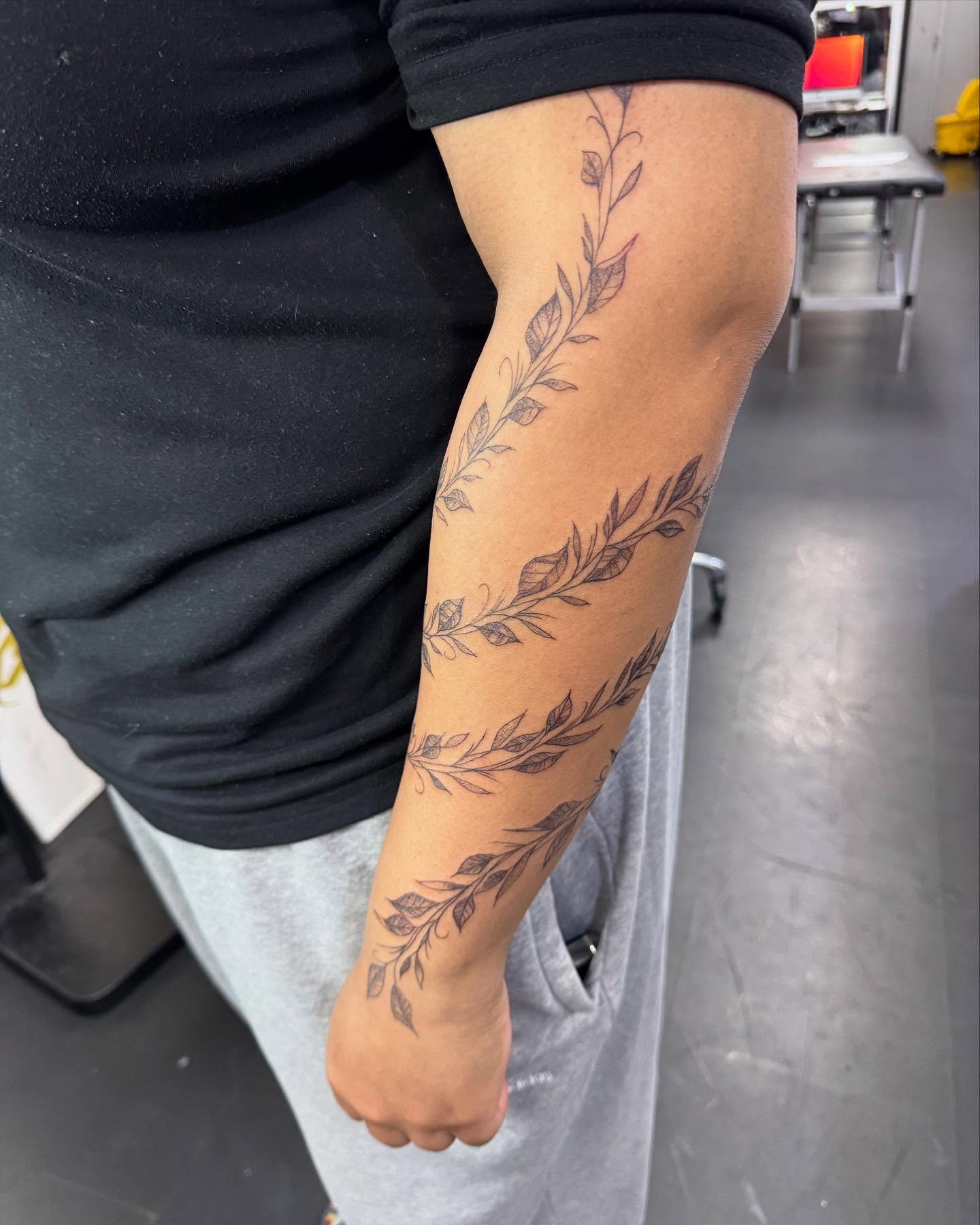 Leaf vine black and grey tattoo on the forearm by Marissa Losier