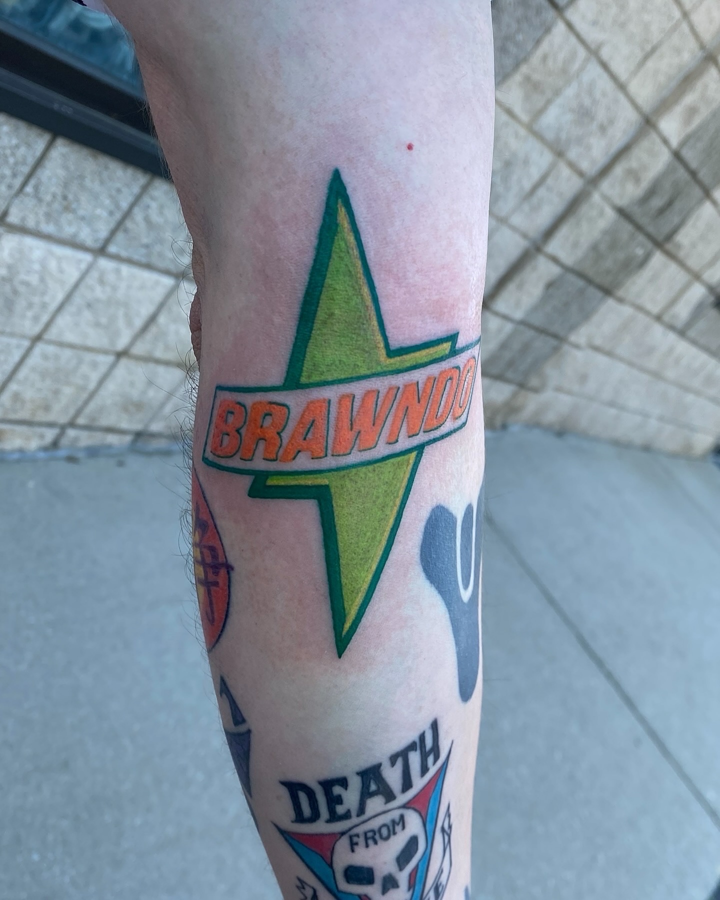 Brawndo logo American traditional tattoo on the forearm by Destinee DeFriece