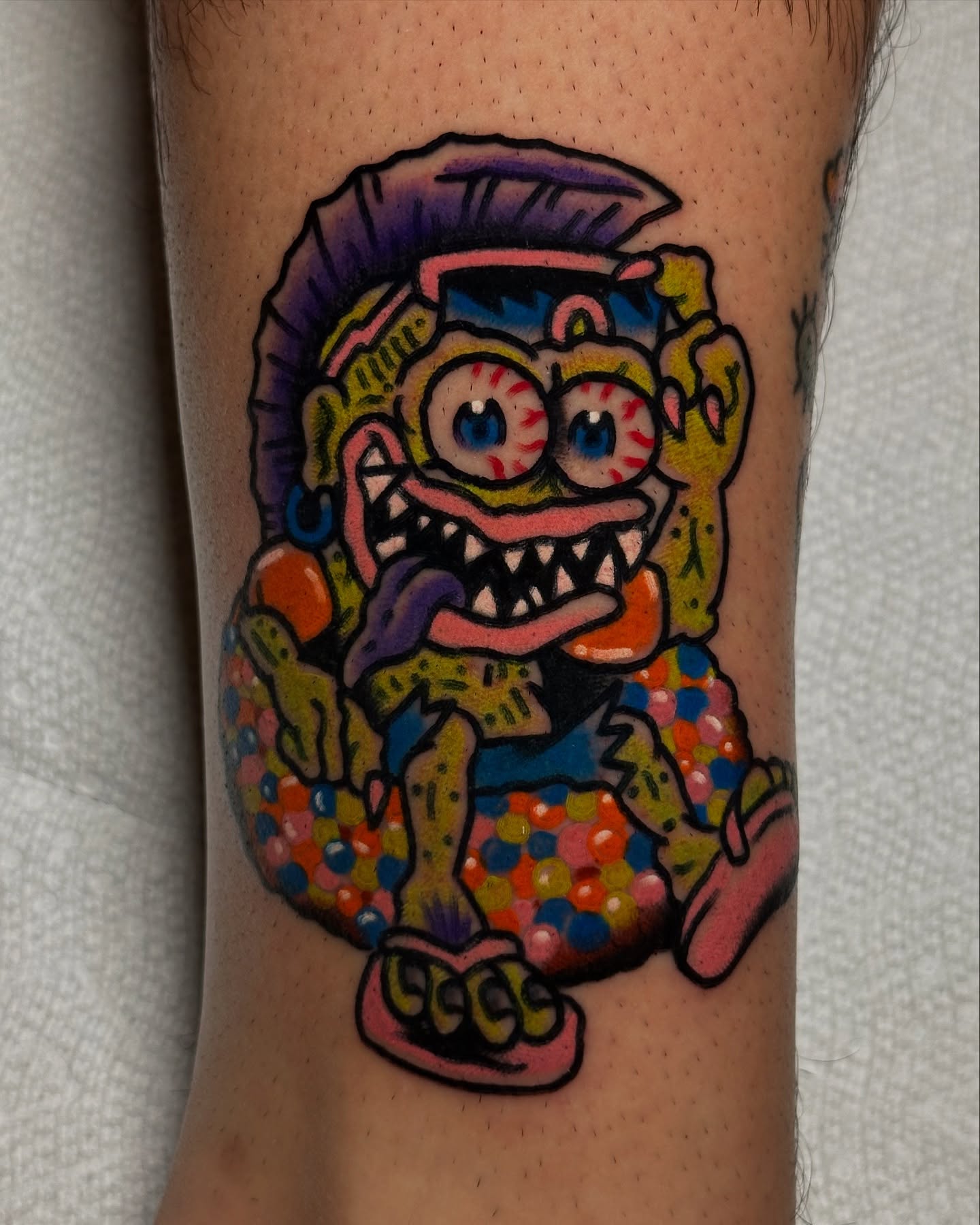Spongebob squarepants trash polka tattoo on the forearm by Michael Williams