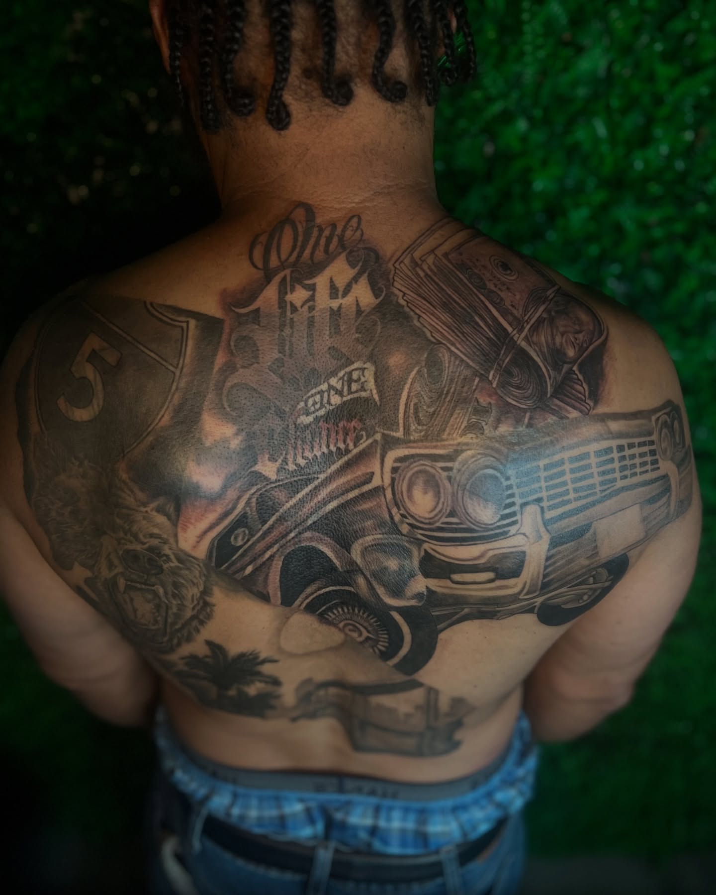 Car black and grey tattoo on the back by Los Angeles Tattoo Artist