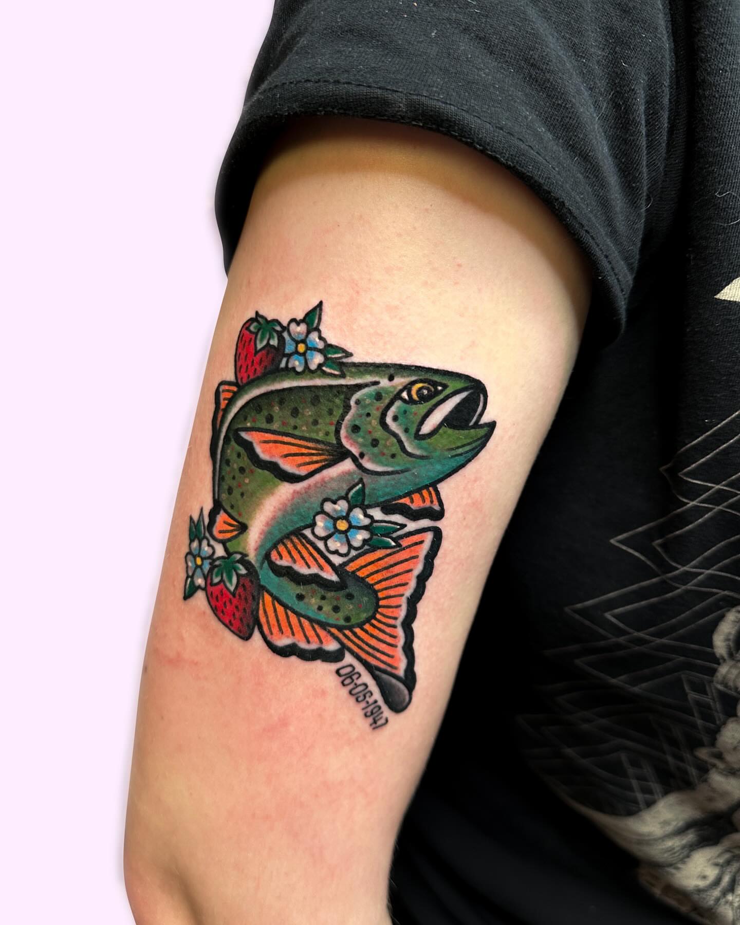 Salmon with flowers American traditional tattoo on the forearm by Gabby Tolley🌛