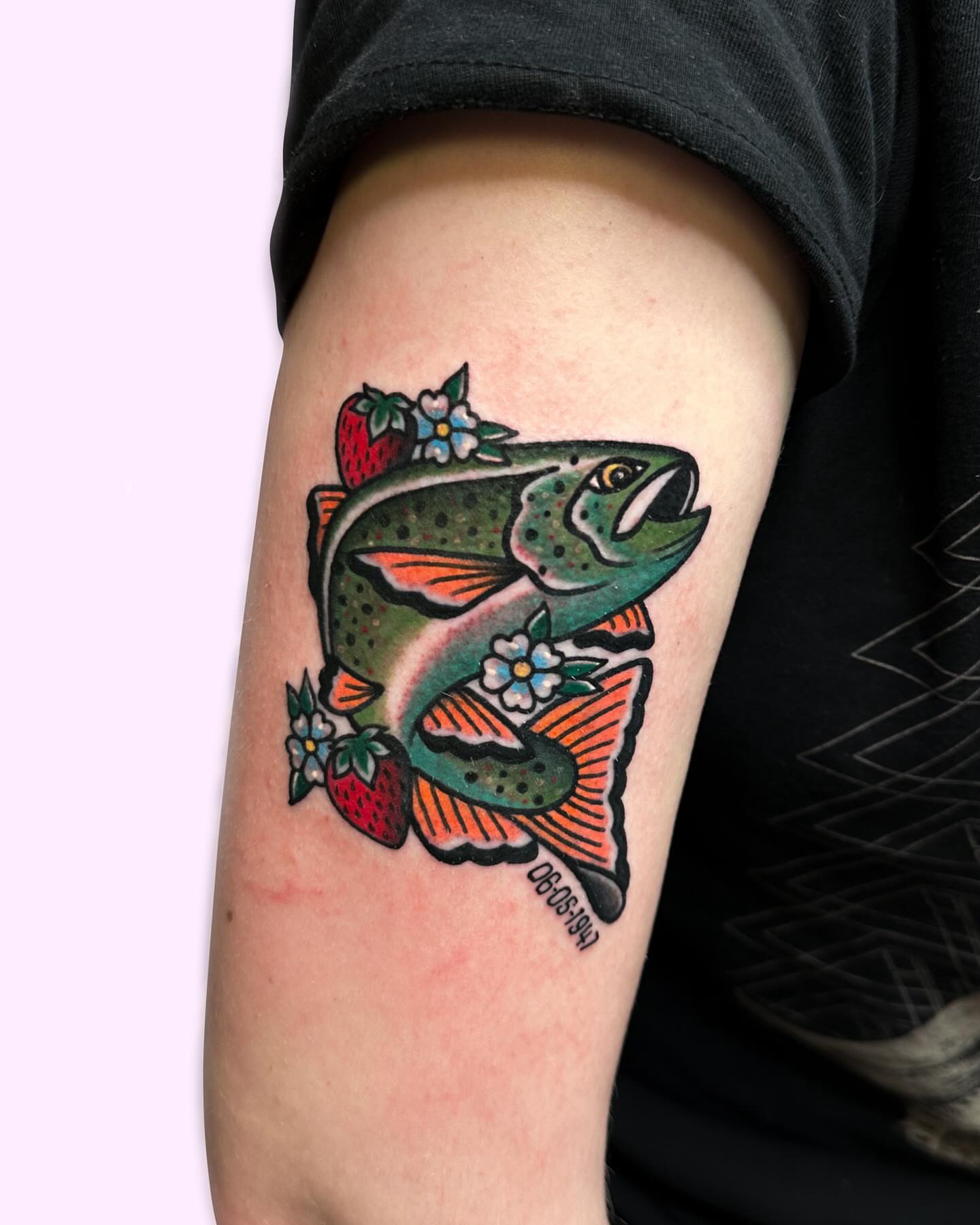 Salmon and flowers American traditional tattoo on the forearm by Gabby Tolley🌛