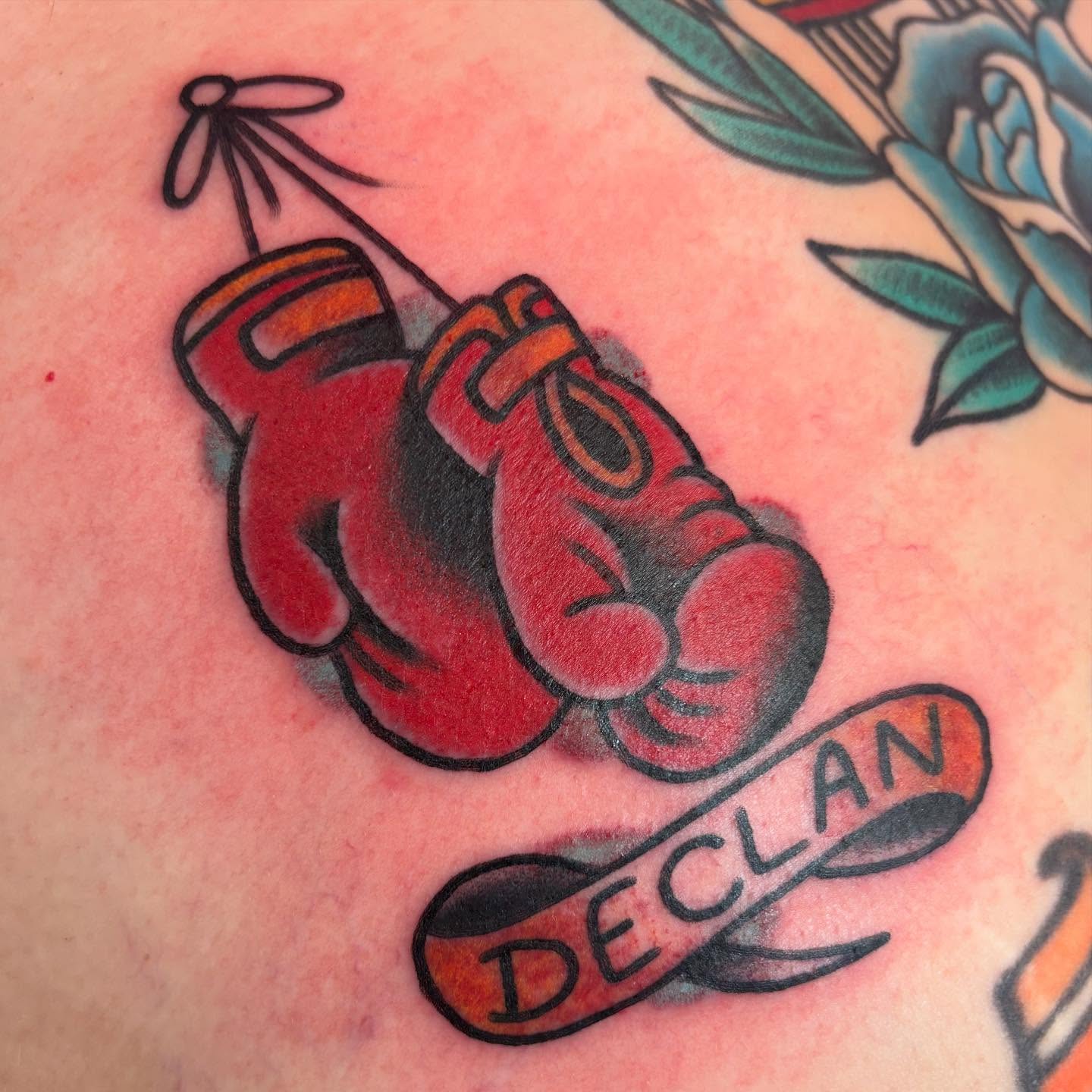 Boxing glove American traditional tattoo on the forearm by @dannydoestattoos