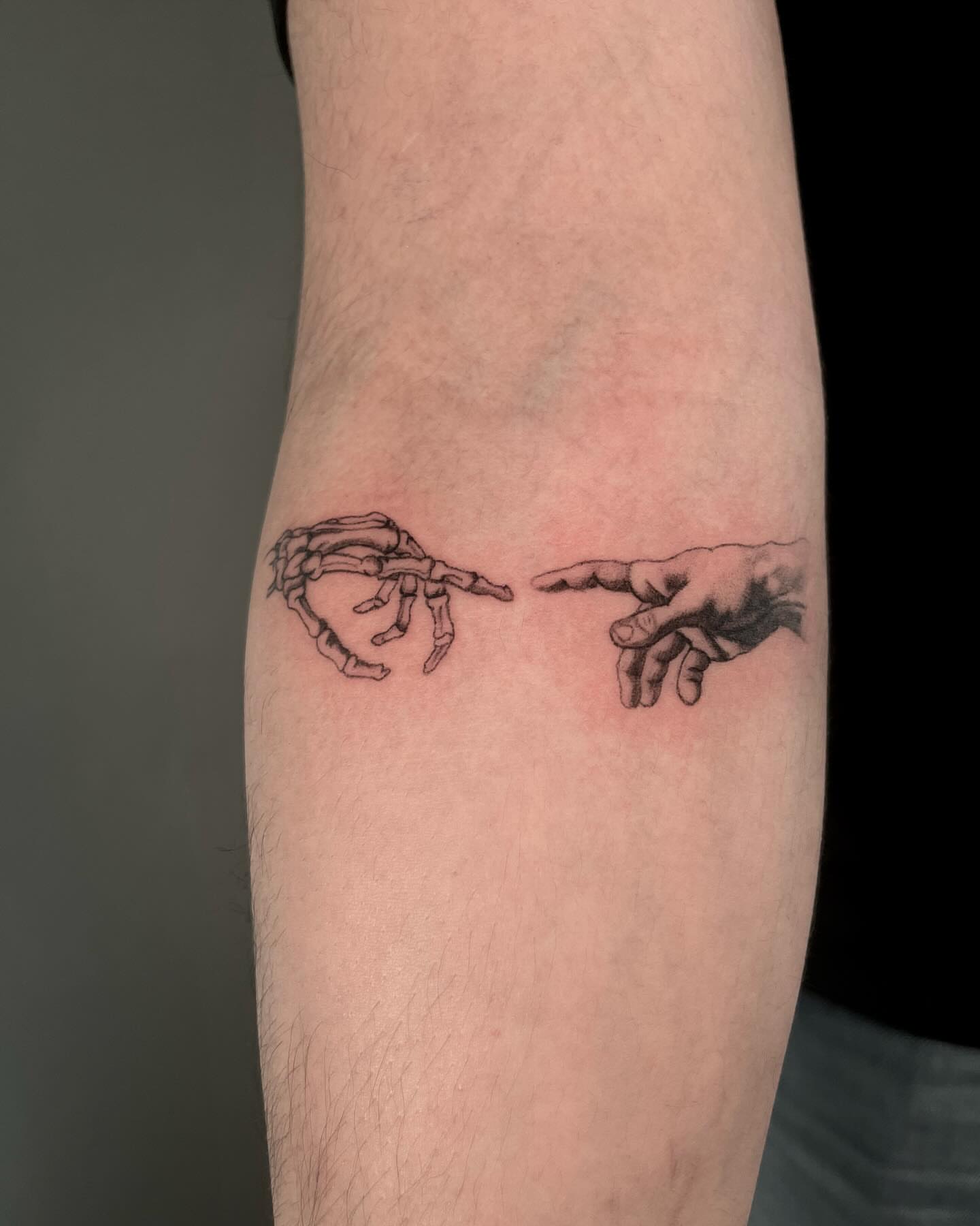 Creation moment realism tattoo on the forearm by Anthony “Jiinky” Quintanilla 🧸☁️