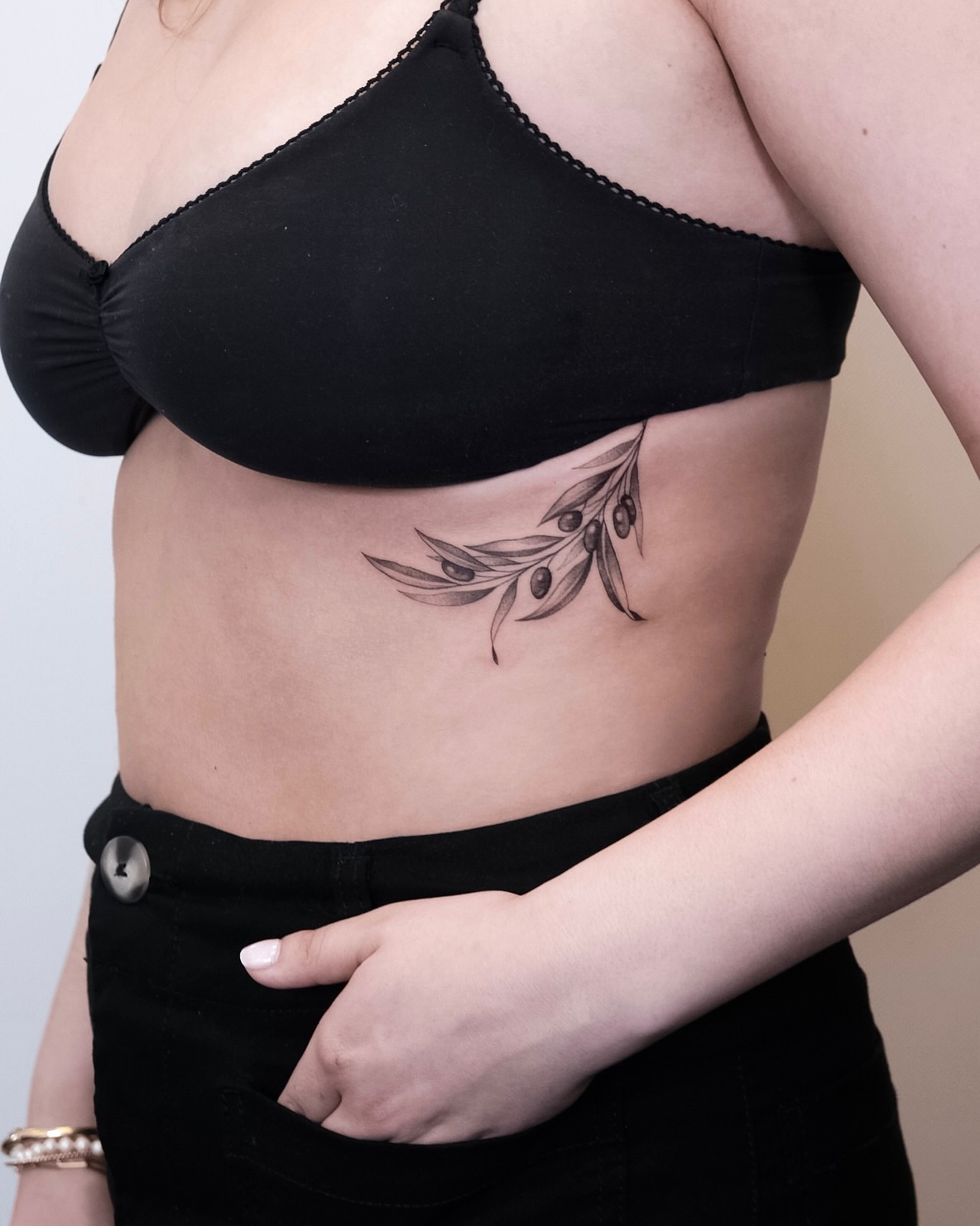 Olive branch black and grey tattoo on the ribs by Your tattoo Artist, New York, New York