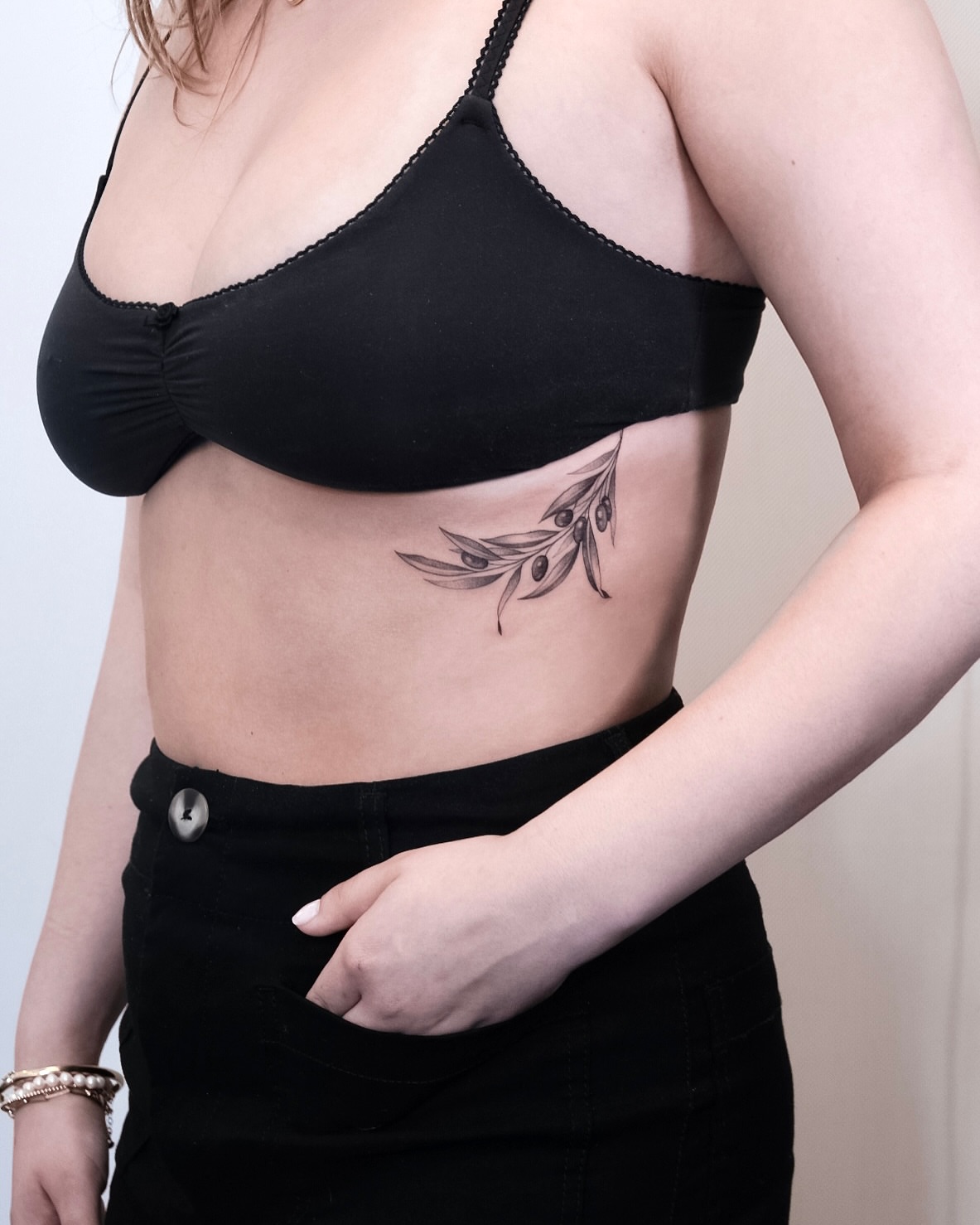 Olive branch black and grey tattoo on the ribs by Your tattoo Artist, New York, New York