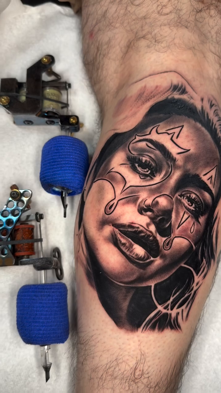 Woman's portrait with tear makeup realism tattoo by Sloe Rivera