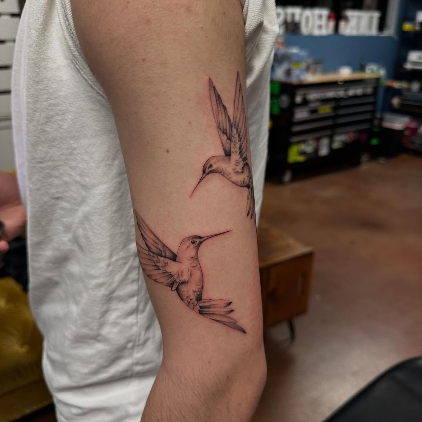 Hummingbirds realism tattoo on the forearm by Summers