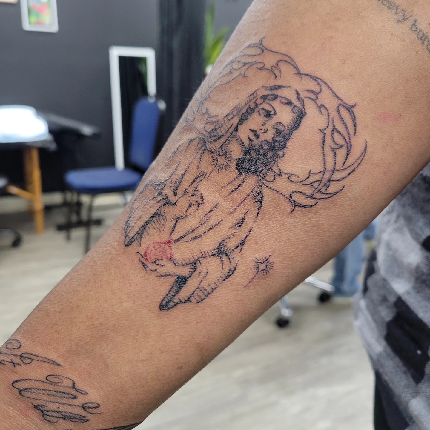 Religious figure black and grey tattoo on the forearm by LolaCat🐉