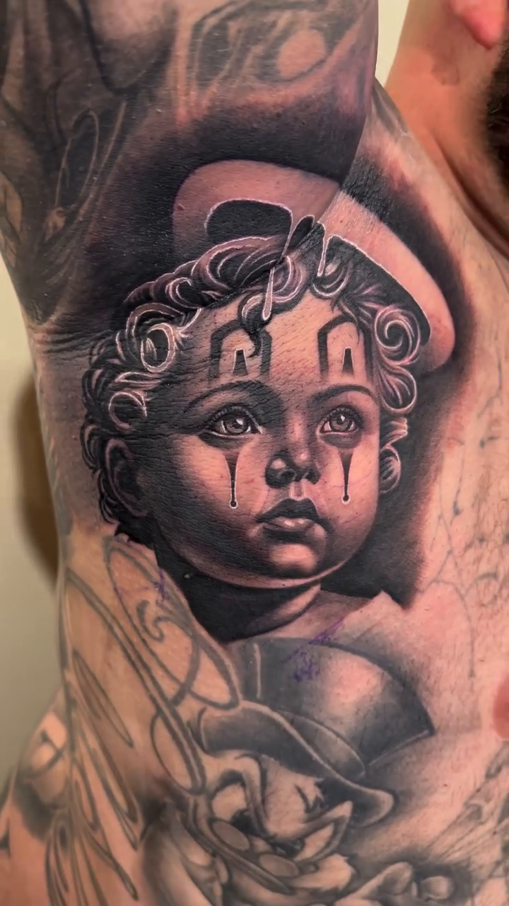 Sad clown baby Chicano tattoo by Joshua ramirez, Montebello, California