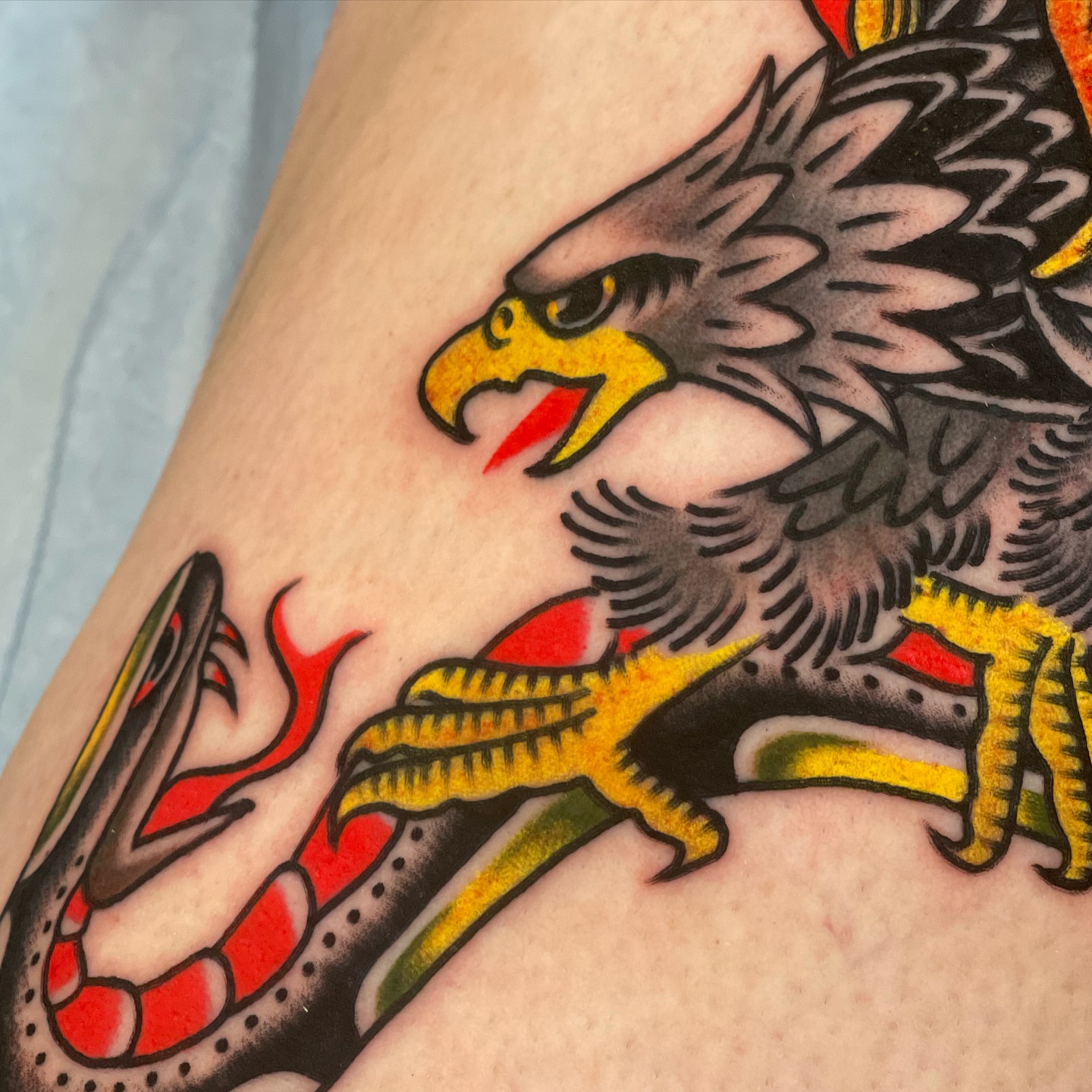 Eagle and snake American traditional tattoo on the forearm by Jeff Miller philly traditional tattoo