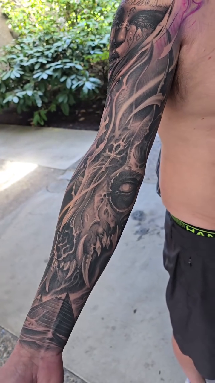 Tattoo by @gagecheesmantattoos — dark_realism, black_and_grey