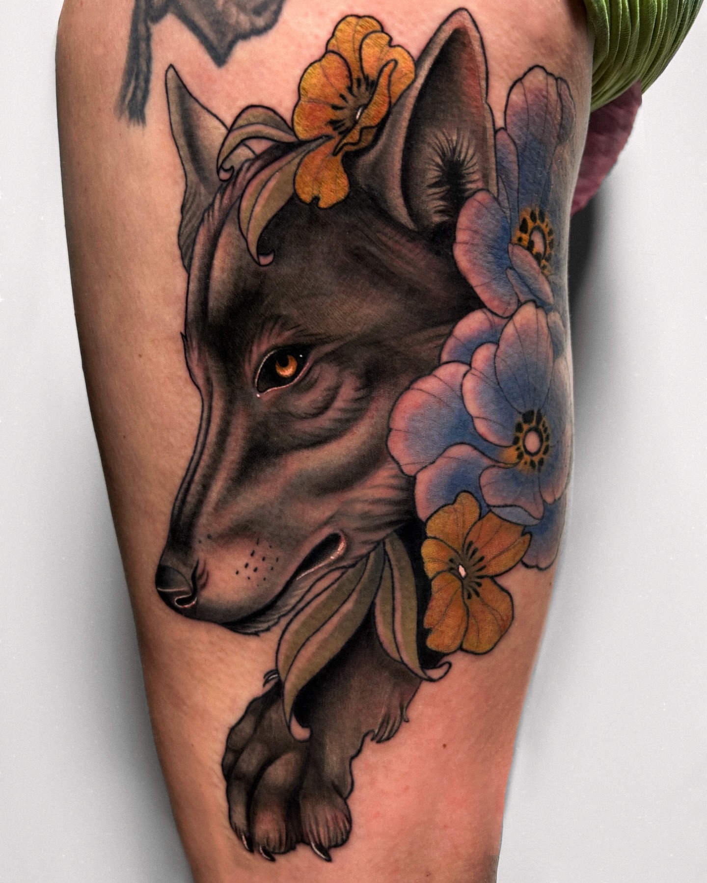 Wolf with flowers realism tattoo on the forearm by Tattoos By Lola Cavotta, Willoughby, Ohio