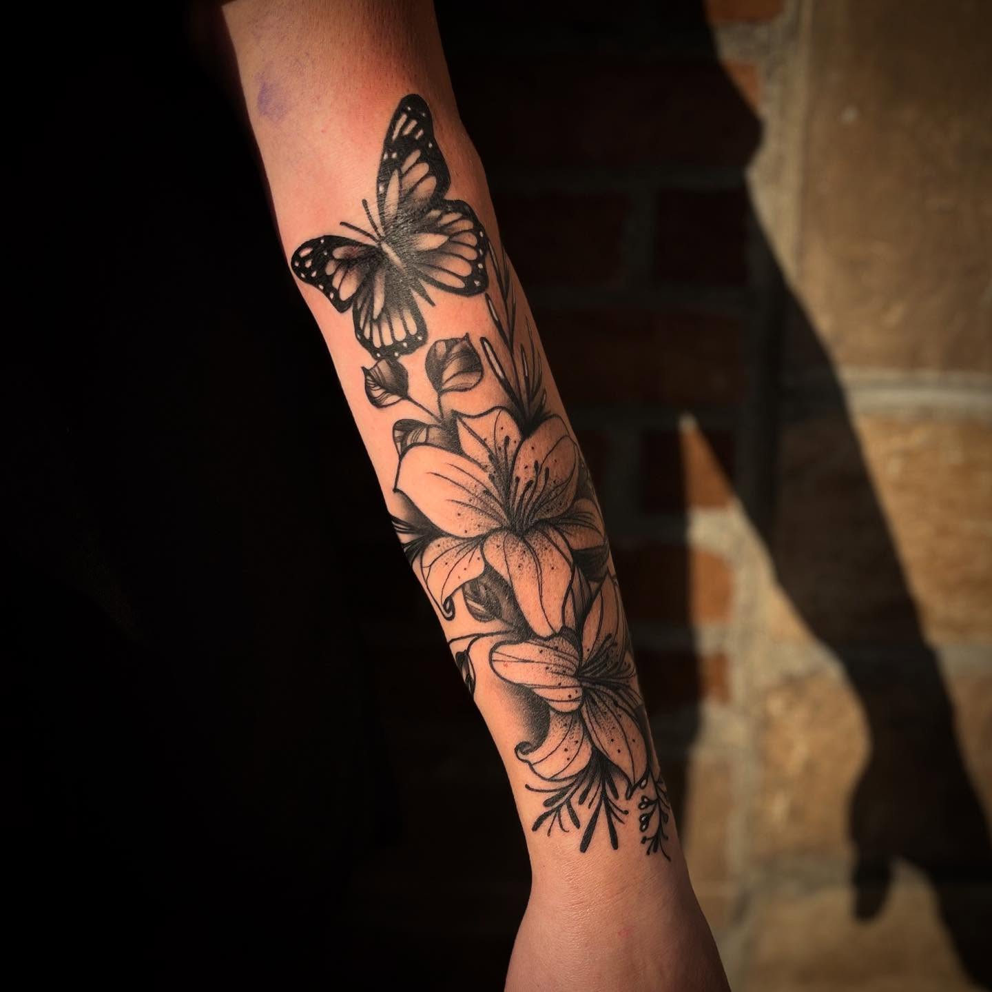 Butterfly and flowers realism tattoo on the forearm by π΅πππππ