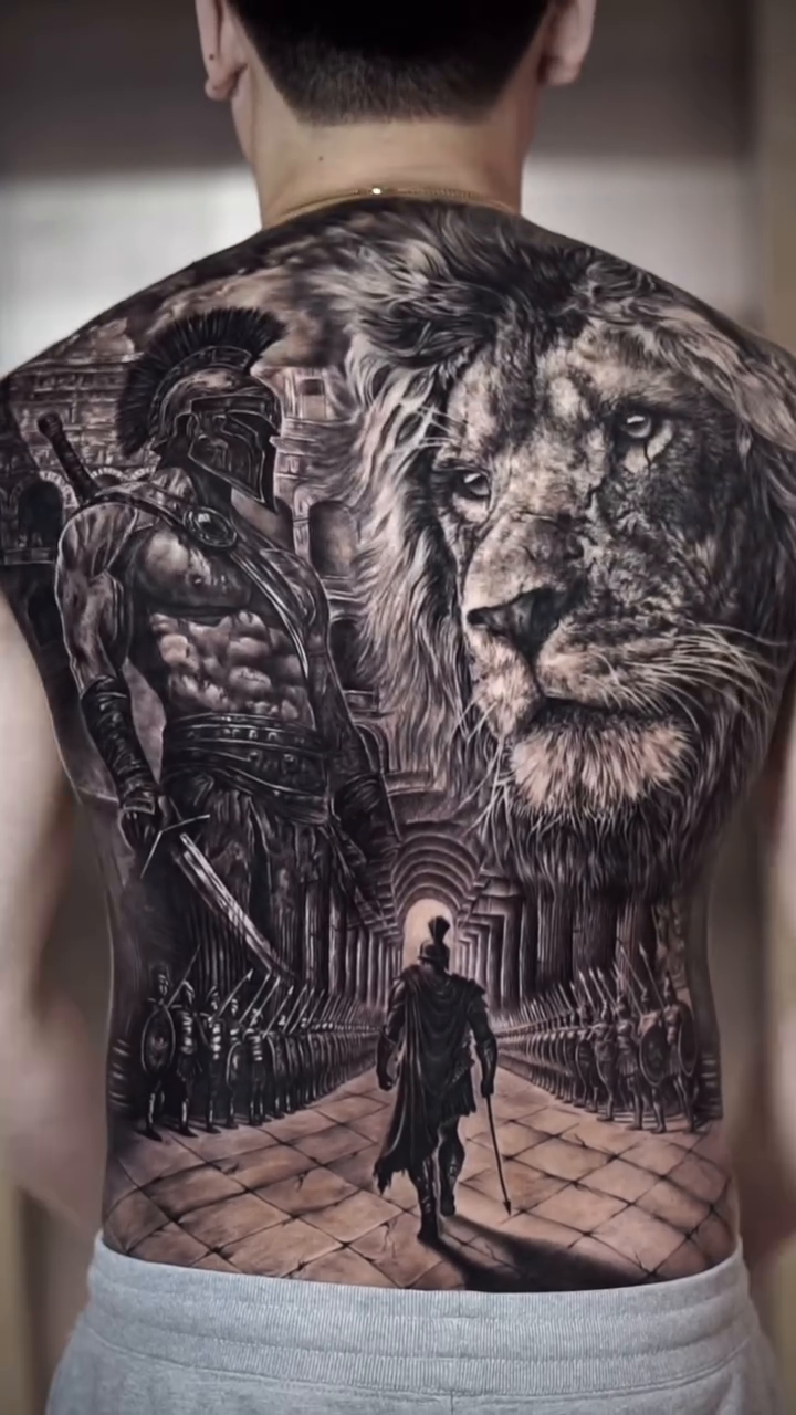 Man walking towards a lion realism tattoo by Bình Nguyễn